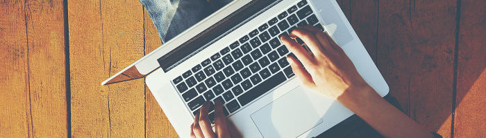 Man using laptop to look at landing pages